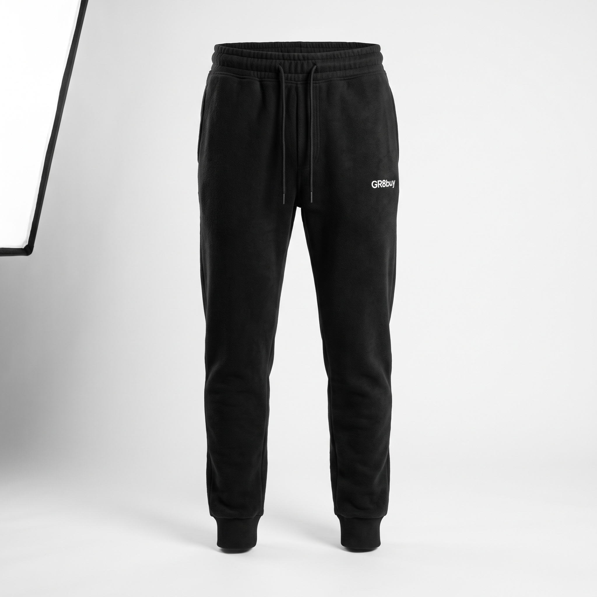 Momentum Tapered Jogger in black with GR8buy hip logo, front view
