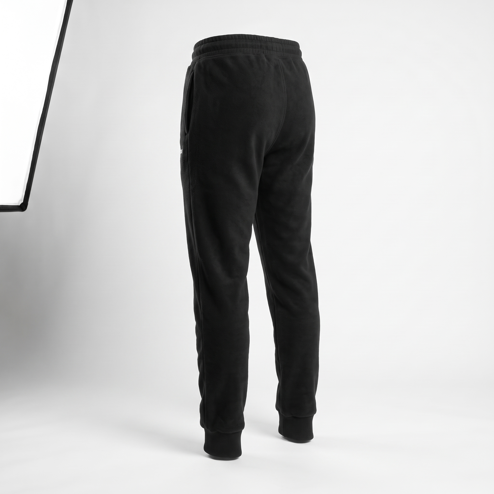Momentum Tapered Jogger in black, back view