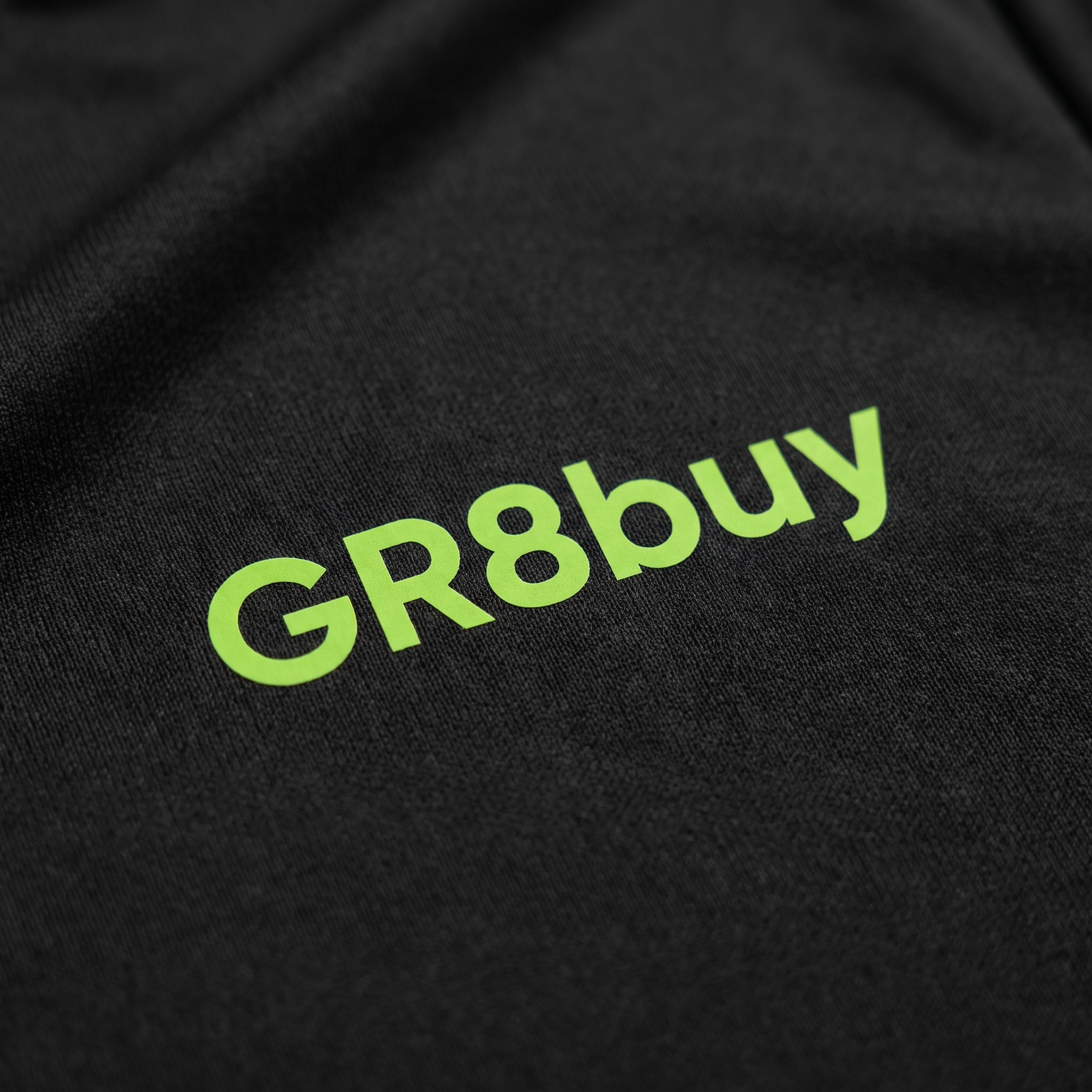 Baseline Performance Tee, close-up detail of chest logo and fabric