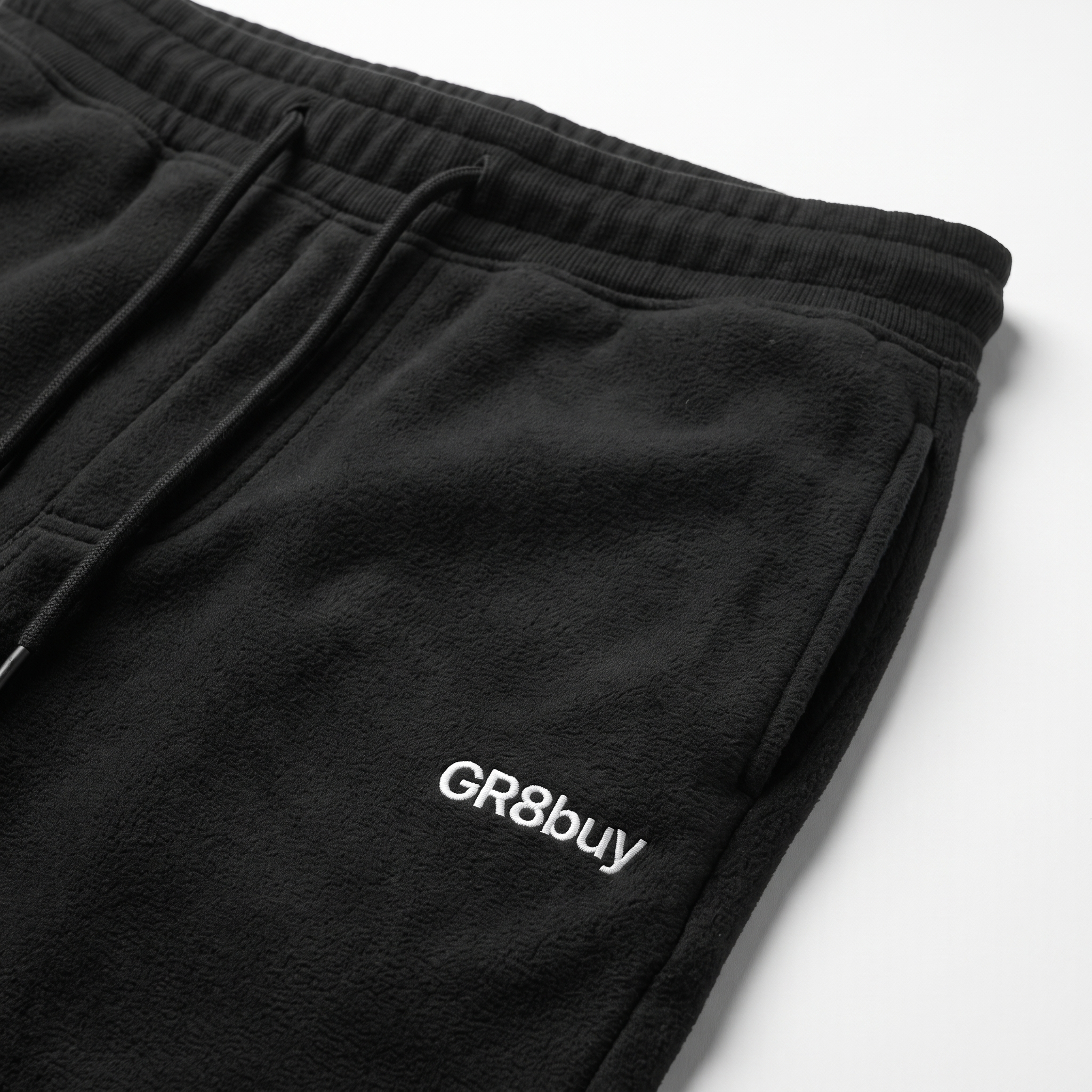 Momentum Tapered Jogger, close-up detail of hip logo and waistband