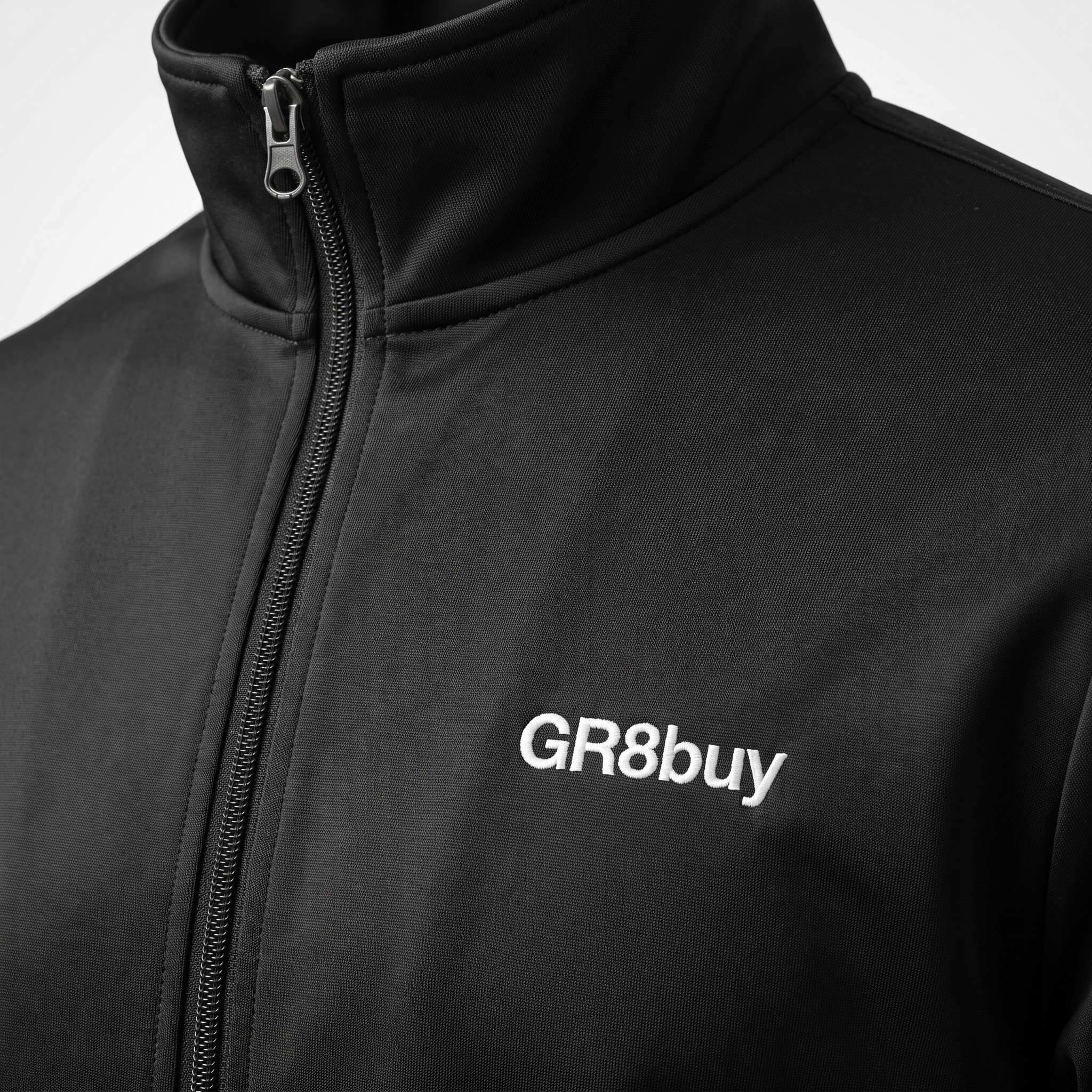 Momentum Track Jacket, close-up detail of chest logo and zipper
