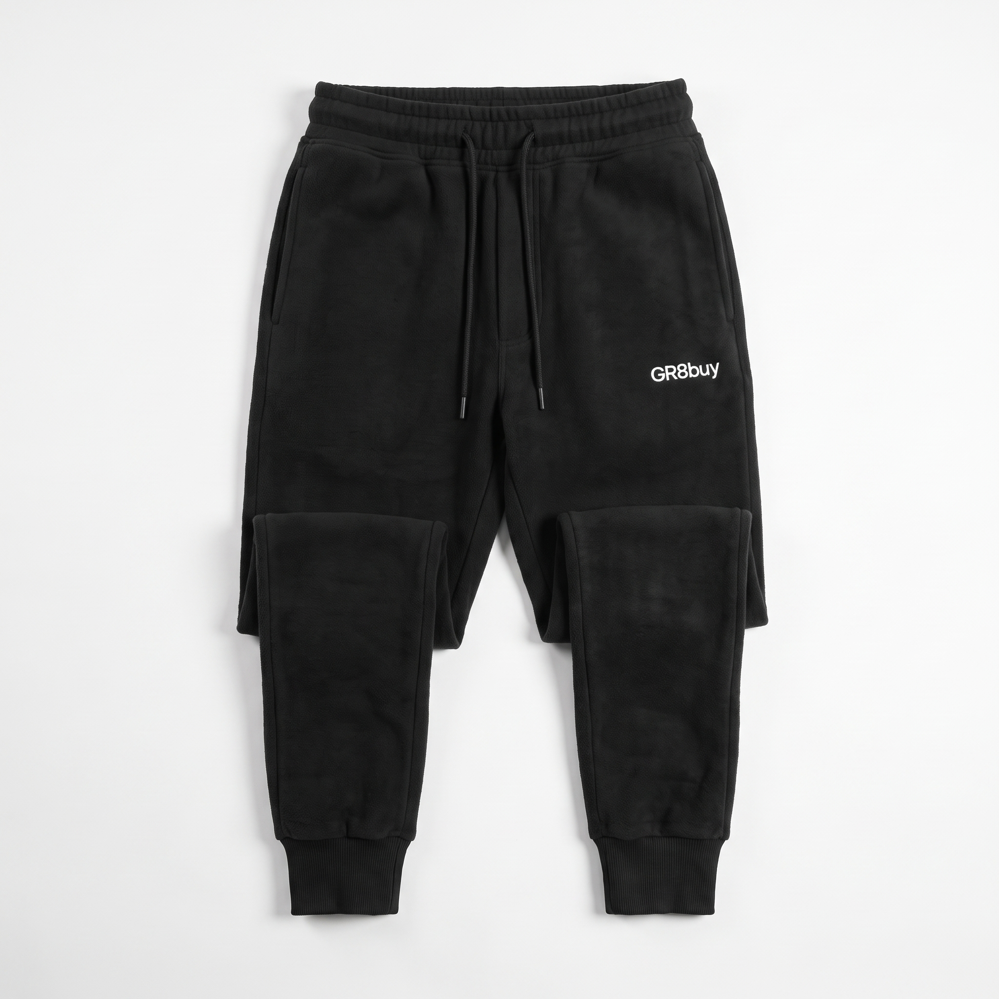 Momentum Tapered Jogger in black, flat-lay view
